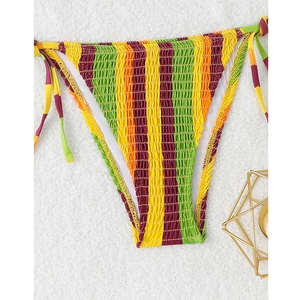 Detail of colorful striped bikini bottom with smocked fabric texture and side ties