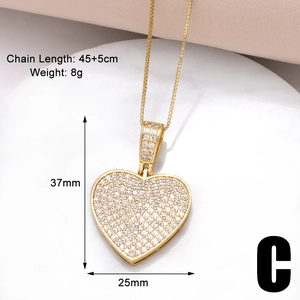 Detailed view of gold heart pendant with white zircon stones and dimension labels