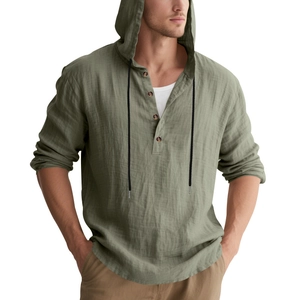 Detail of sage green linen hoody with buttoned placket and black contrast drawstrings