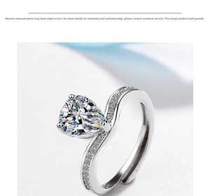 Close-up of a pear-cut cubic zirconia ring with curved pavé-set adjustable band