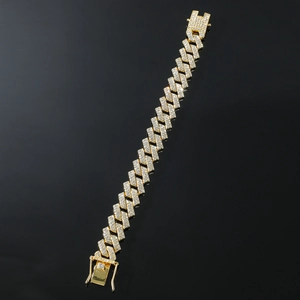 Detailed view of luxury gold-plated Cuban link bracelet with full diamond pavé setting