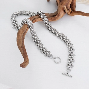 Silver chunky chain necklace with OT toggle clasp displayed on natural wood decor