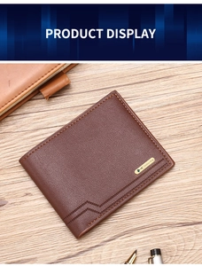 Brown leather wallet on wooden desk with pen and notebook in professional business setting