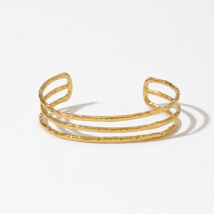 Minimalist gold plated stainless steel open bangle featuring a unique wavy geometric design