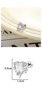 Detail view of heart zircon earrings with bow accent showing dimensions 0.9cm by 1.2cm