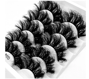 Close-up of model G04 thick messy style faux mink eyelashes in 5-pair white storage tray