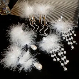 Elegant white feather earrings with teardrop pearls and crystal tassels for wedding parties