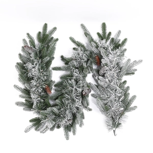 Artificial flocked Christmas garland with realistic snow effect and small pine cones