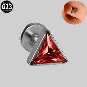 Detail of red triangular cubic zirconia earring set in polished G23 titanium metal