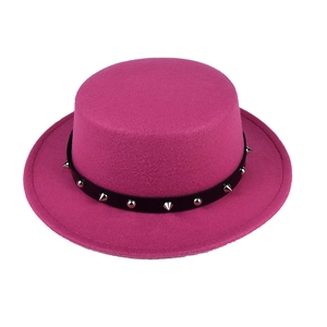 Detail of fuchsia wool top hat featuring a black leather band with silver cone studs