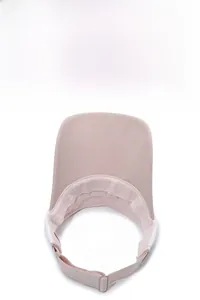 Macro view of pink breathable fabric sun visor with wide brim and adjustable strap