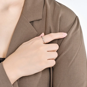 Minimalist silver teardrop geometric ring on model finger for chic office styling