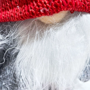Handmade Christmas gnome with red knitted hat and white beard Rudolph table decoration