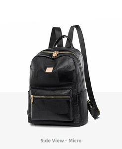 Detail view of black textured leather backpack featuring premium golden zippers and hardware