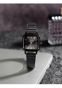 Macro shot of GEDI square black dial watch with steel band on laptop background
