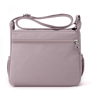 Waterproof purple nylon crossbody bag for women with adjustable strap and multiple pockets