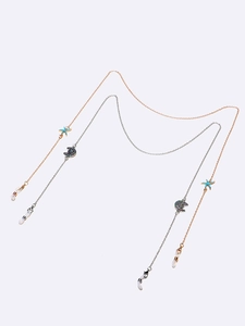 Set of two glasses chains with turquoise starfish and crystal moon pendants on white background