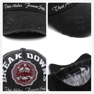 Close-up of vintage BREAK DOWN baseball cap with heavy embroidery and distressed details