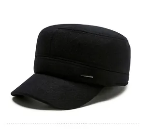 Detail of winter thermal flat cap for men with side metal sports logo badge