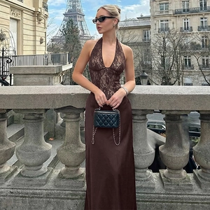 Detail of dark brown lace patchwork halter dress with Eiffel Tower street view background
