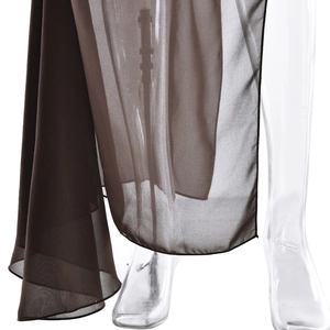 Detailed macro shot showing the sheer brown chiffon fabric drape and hem of the maxi dress