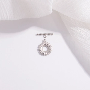 Macro detail of S925 sterling silver daisy flower OT toggle clasp for jewelry making
