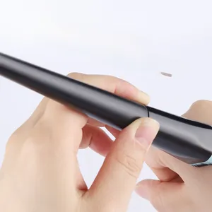 Close-up of matte black chunky handle and polygonal aluminum tube on foundation brush