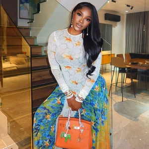Women's chic printed long sleeve top and matching A-line skirt with orange fish pattern
