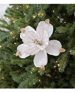 Detail of white magnolia Christmas flower with velvet texture and golden glitter edges