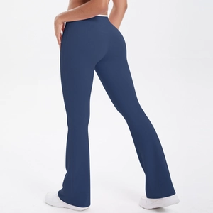 Back view of high-waisted navy flare yoga pants with tummy control and slim fit design