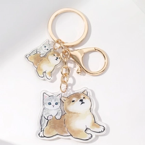 Acrylic keychain featuring cute cartoon shiba inu and cat with golden metal clip hardware