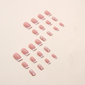 French style marble press-on nails with pink base, white tips and golden glitter accents