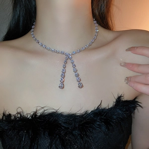 Detailed view of an elegant silver Y-shaped tassel choker with zircon water drop pendants