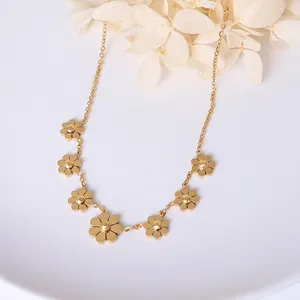 Minimalist gold plated titanium steel anklet featuring seven elegant daisy flower charms