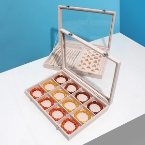 Pink velvet jewelry display box with 12 compartments and clear glass lid for storage