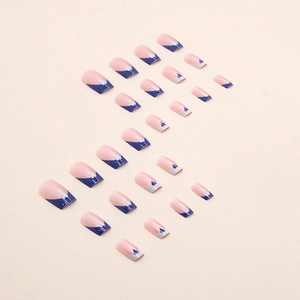 Blue French square press-on nails with pink base and heart cutout design on beige background