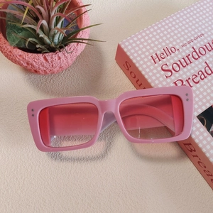 Pink Y2K rectangular sunglasses with silver rivets and matching tinted lenses