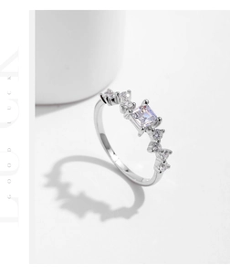 Detailed macro shot of an S925 silver ring featuring an emerald-cut zirconia center stone