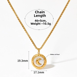 Detail of moon mother of pearl pendant with hammered golden stainless steel finish
