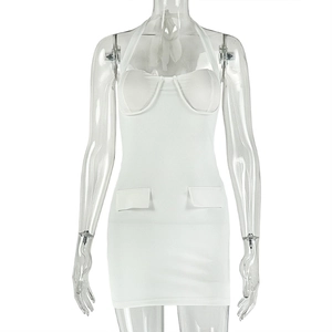 Detail of white halter neck dress with bustier padding and decorative pocket flaps