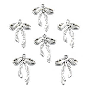 Set of six polished silver alloy hollow bow charms for DIY jewelry making and crafts
