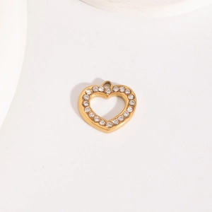 Detailed view of a golden heart pendant with hollow center and sparkling rhinestones