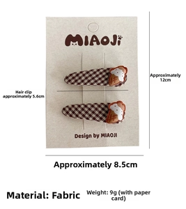 Detail of plaid fabric hair clips with embroidered ice cream and 5.6cm size measurement