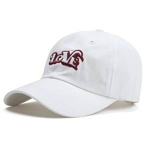 Close-up of 3D red LOVE embroidery on a white cotton baseball cap with ventilation holes