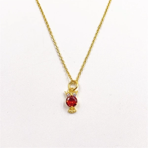 Elegant owl pendant necklace in gold finish with a vibrant red center gemstone
