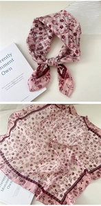 Floral print pink cotton linen scarf shown tied and flat on white background