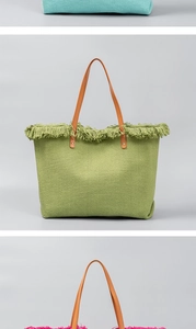 Detailed view of woven tote bags with colorful fringe trim and brown leather handles