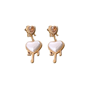 Elegant gold drop earrings with amber crystal heart and white pearl-like heart shape