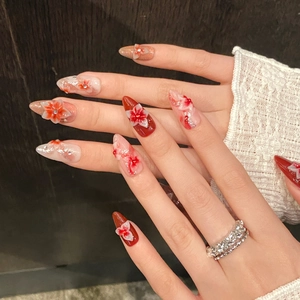 Exquisite 3D floral almond press-on nails with red and pink gradient and rhinestones