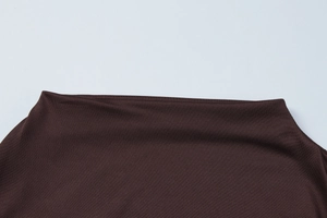 Detailed close-up of dark brown knit fabric texture on this stylish long sleeve dress